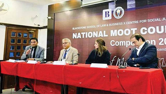 Experts are seen seated on the stage during a moot on “The Scope of Article 20 and the Constitution of Pakistan and Practices” under the Centre for Social Justice and Blackstone School of Law and Business. — The Nation