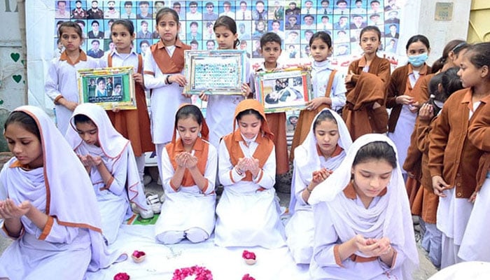Students recite a prayer for martyrs of the APS attack on December 16, 2023. — APP