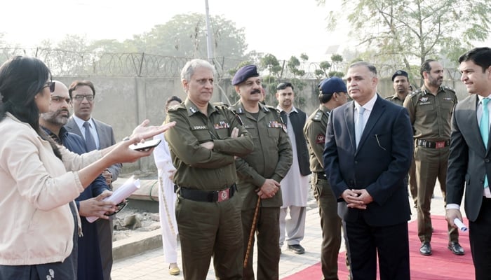 IG Punjab Dr Usman Anwar (c) listens to a briefing during his visit to the Organised Crime Unit Headquarters Township on December 13, 2023. — Facebook/Punjab Police Pakistan