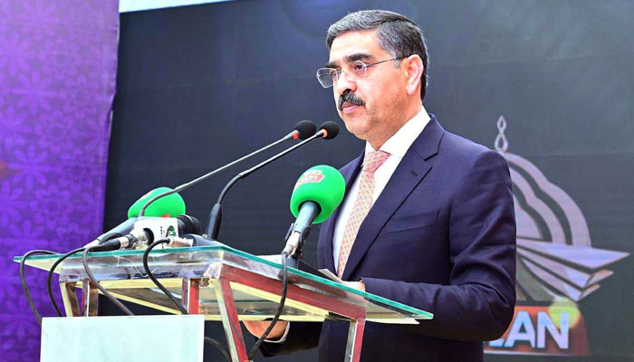 Caretaker Prime Minister Anwaar-ul-Haq Kakar addresses the inaugural ceremony of the Hazargi language broadcast on PTV Bolan on December 19, 2023. — APP