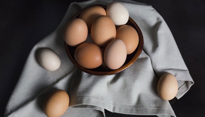This representational image shows eggs kept in and outside a bowl. — Unsplash