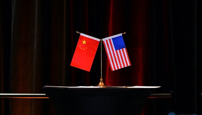 This image shows the flags of China (L) and the US. — Xinhua/File