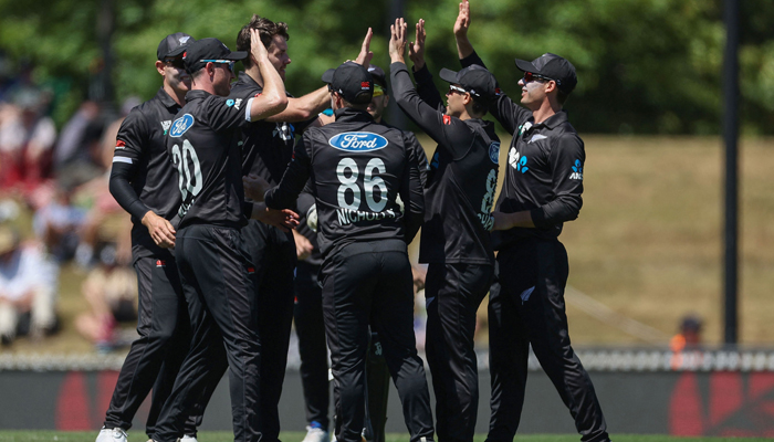 New Zealand players celebrate Bangladeshs captain Najmul Hossain Shanto being caught during the second one-day international cricket match between New Zealand and Bangladesh at Saxton Oval in Nelson on December 20, 2023. — AFP