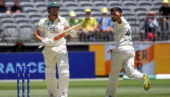 Australias Mitchell Marsh (L) is bowled by Pakistans Khurram Shahzad (R) on the second day of the first Test cricket match between Australia and Pakistan in Perth on December 15, 2023. — AFP