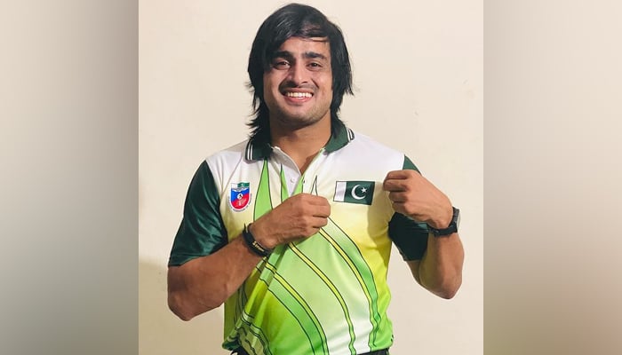Pakistan No. 2 Mohammad Yasir Sultan shows the Pakistani flag on his shirt on October 21, 2023. — Instagram/@yasir__sultan