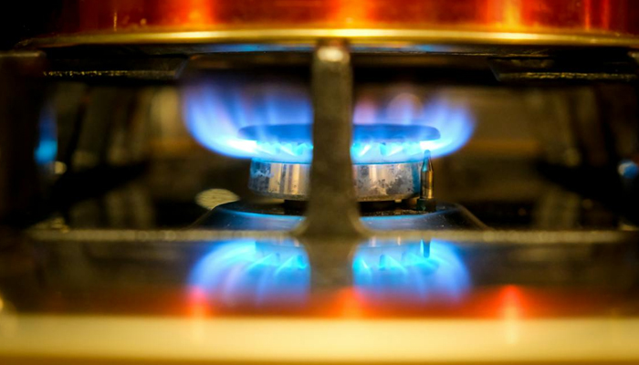 A representational image of a flame lit on a stove. — Pexels