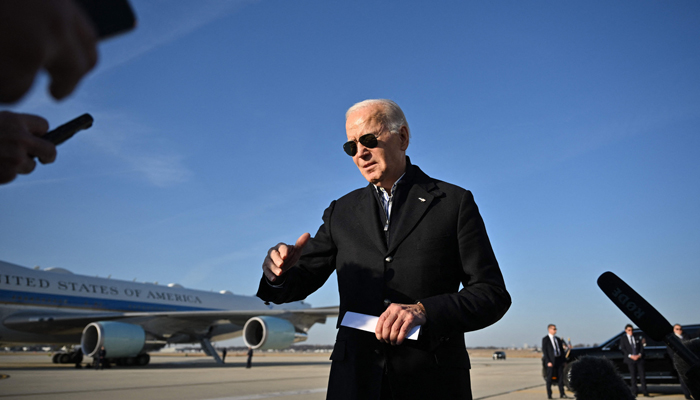 US President Joe Biden speaks before departing from Milwaukee Mitchell International Airport in Milwaukee, Wisconsin, on December 20, 2023, as he returns to the White House. — AFP