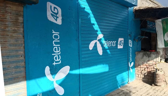A shuttered shop displays Telenors branding. — Facebook/Telenor Pakistan