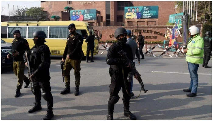 Security personnel stand guard in Lahore. — AFP/File