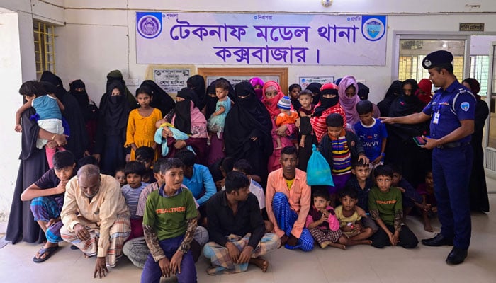 Rohingya refugees detained at a police station in Teknaf, in Bangladeshs southeastern district of Coxs Bazar on November 25, 202. — AFP