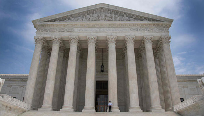 This file photo taken on June 15, 2017 shows a police officer standing guard on the steps of the US Supreme Court in Washington, DC. — AFP