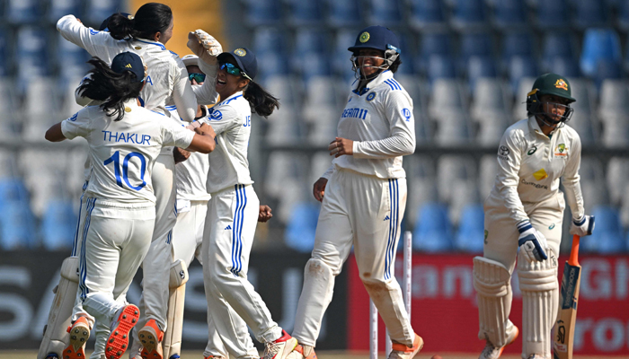 Indias players celebrate after the dismissal of Australias Alana King (R) during the final day of the women´s Test cricket match between India and Australia at the Wankhede Stadium in Mumbai on December 24, 2023. — AFP