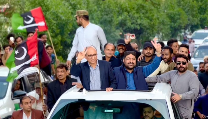In this still, Pakistan Peoples Party (PPP) President Saeed Ghani shows victory symbols to his supporters can be seen on December 24, 2023. — Facebook/Saeed Ghani