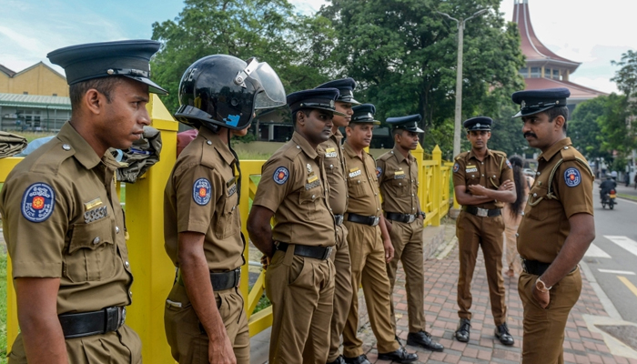 Sri Lankan police officers can be seen standing in this image. — AFP/File