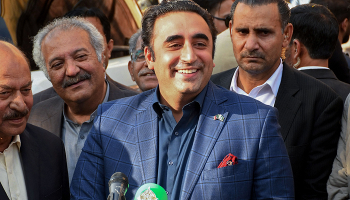 Pakistan Peoples Party (PPP) chairman Bilawal Bhutto Zardari (C) speaks to media after submitting his nomination papers to a returning officer in Larkana of Sindh province on December 24, 2023. — AFP