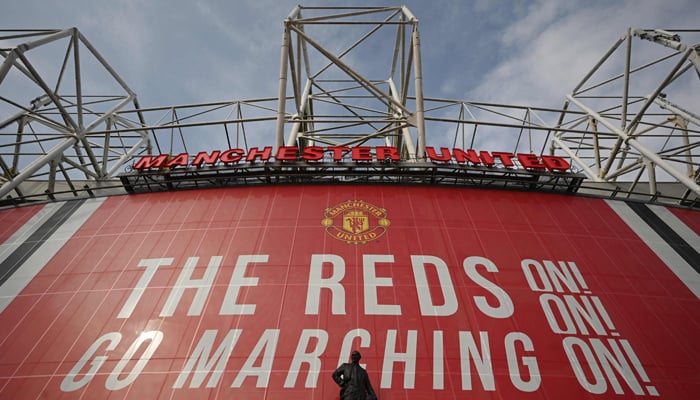 A statue of Matt Busby stands outside Manchester Unites Old Trafford stadium in Manchester, northwest England on April 21, 2021. — AFP