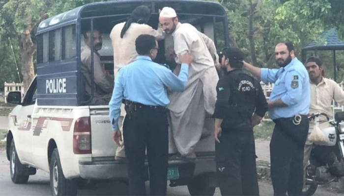 In this picture, Islamabad police can be seen arresting people.—APP/File