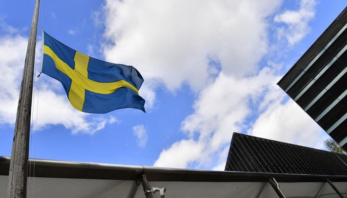 The Swedish flag is hoisted at half-mast. — AFP/File