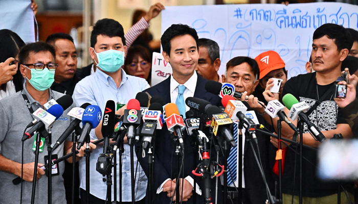 Former Thai prime ministerial candidate and ex-Move Forward Party leader Pita Limjaroenrat speaks to media as he leaves a hearing regarding his ownership of media shares at the Constitutional Court in Bangkok on December 20, 2023. — AFP
