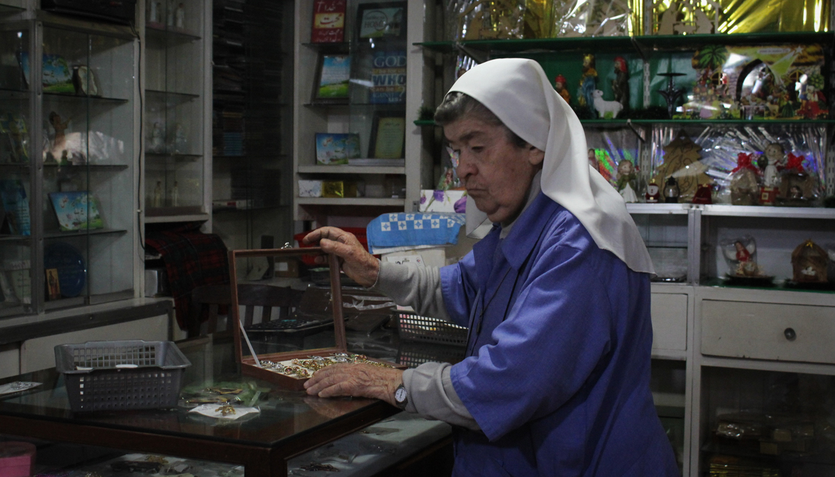 Sister Agnes Grones keeps a check on a stock of ornaments at the store. — Photo by author