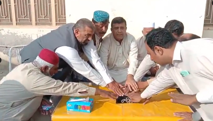 This still shows former MNA Basit Khan taking oath from people on the Holy Quran on December 25, 2023. — Social media