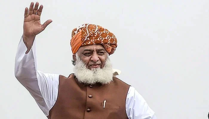 Maulana Fazl ur Rehman waves to a crowd at a rally. — AFP/Files