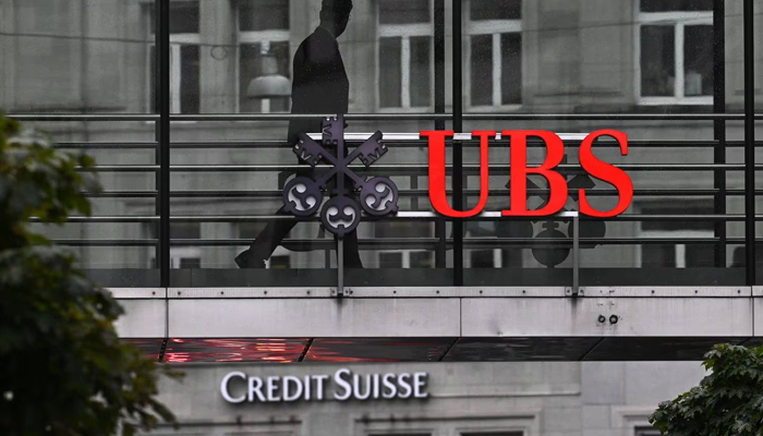 This Image shows the logos of the Swiss banks Credit Suisse and UBS. —AFP/File
