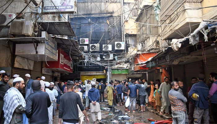 Volunteers conducted Search and rescue works after a fire broke out in Saddars mobile market on December 26, 2023. — ONLINE