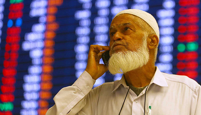A stockbroker monitors the share prices during a trading session at the Pakistan Stock Exchange (PSX) in Karachi, Pakistan, on December 26, 2023. — INP