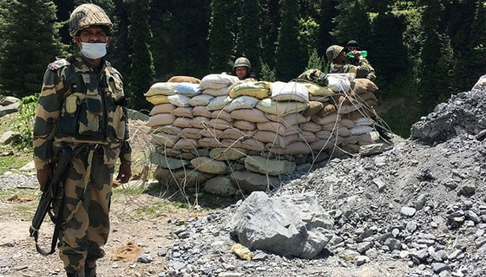 Indian Border Security Force soldiers guard a highway leading towards Leh, bordering China, in Gagangir. — AFP/File