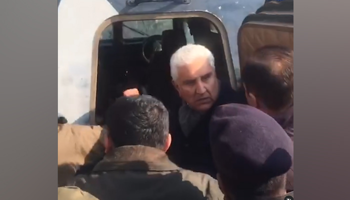 Vice Chairman of PTI Shah Mahmood Qureshi being heckled in Rawalpindi, on December 27, 2023, in this still taken from a video. — Instagram/@geourdudottv