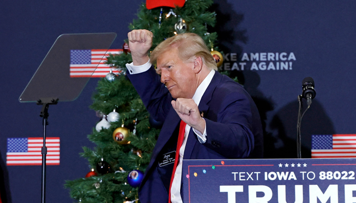 Former US President and 2024 presidential hopeful Donald Trump gestures during a campaign event in Waterloo, Iowa, on December 19, 2023. — AFP