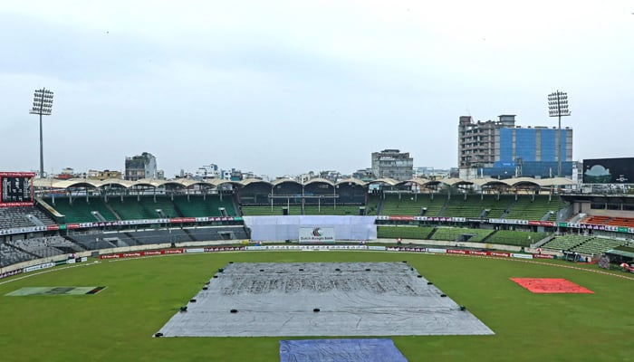 The covered pitch is pictured as rain delays the second day play of the second Test cricket match between Bangladesh and New Zealand at the Sher-E-Bangla National Cricket Stadium in Dhaka on December 7, 2023. — AFP