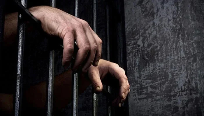 This image shows the hands of an incarcerated person. — AFP/File