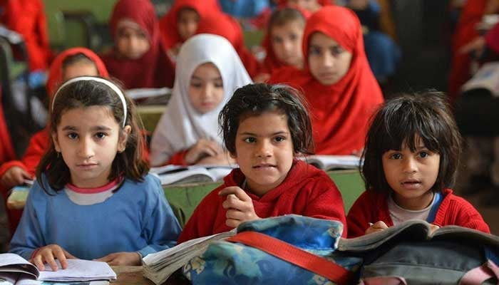 This image shows children sitting in a classroom. — AFP/File