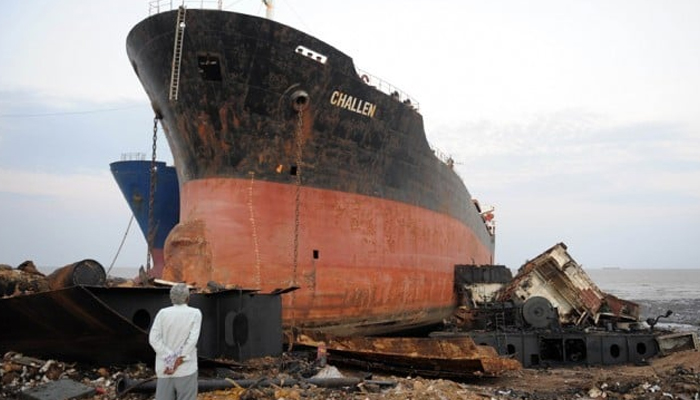 This representational image shows a man standing near the ship in Gadanis shipbreaking yard, in Balochistan. — AFP