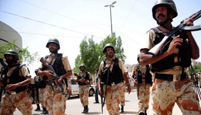 Sindh Rangers personnel stand on the road in Karachi. — AFP/File
