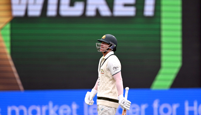Australian batsman David Warner walks off after being dismissed on the third day of the second cricket Test match between Australia and Pakistan at the Melbourne Cricket Ground (MCG) in Melbourne on December 28, 2023. — AFP