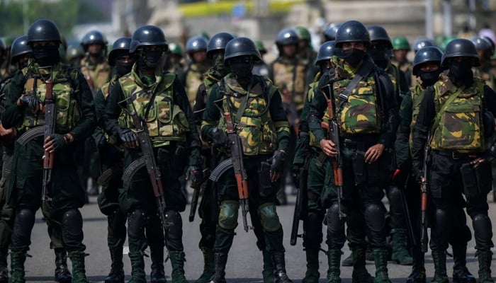 Sri Lankan troops can be seen standing guard. — AFP/File