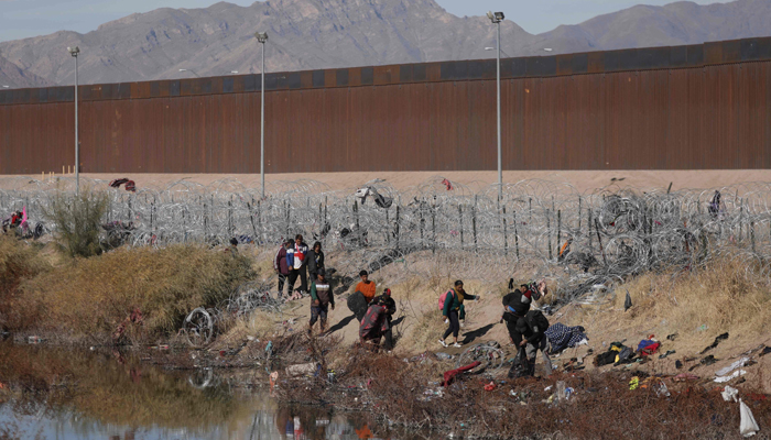 Migrants arrive at the border between Mexico and the US through Ciudad Juarez, Chihuahua State, Mexico, on December 28, 2023. — AFP