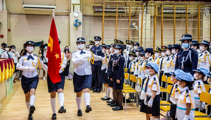 Students march during a flag-raising ceremony to mark Chinas National Day in Hong Kong. — AFP/File