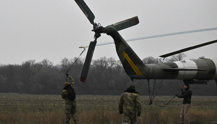 Ukrainian servicemen of an Army Aviation Brigade prepare a Mi-8 helicopter to fly in the Donetsk region on December 7, 2023. — AFP