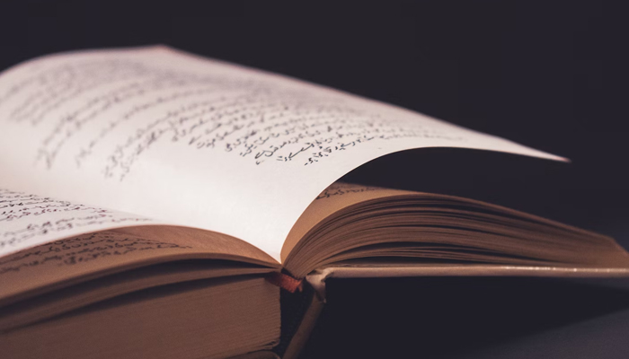 This representational image shows a book open on the table. — Unsplash