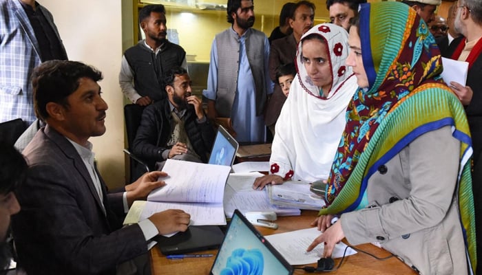 Women candidates submit their nomination papers ahead of the upcoming 2024 general elections at the deputy commissioners office in Quetta on December 22, 2023. — AFP