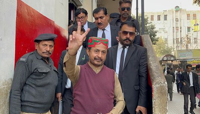 Former Sindh Assembly opposition leader and PTI leader Haleem Adil Sheikh shows a victory sign after the court hearing on January 2, 2024. — Facebook/Haleem Adil Sheikh