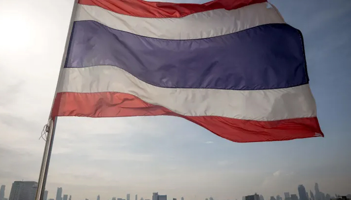 The flag of Thailand flies over Bangkok on the eve of the general election on May 13, 2023. —AFP