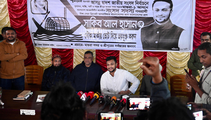 National cricket team captain and election candidate of the ruling Bangladesh Awami League Shakib Al Hasan (R), speaks with the media before the start of his campaign ahead of the 2024 general elections, in Magura on December 27, 2023. — AFP