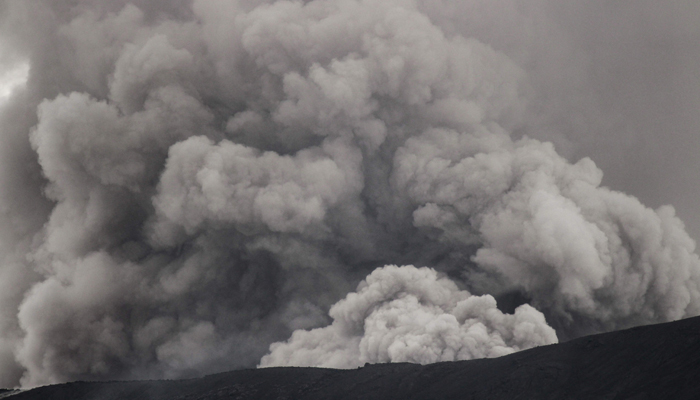 Mount Marapi spews colomns of volcanic ash during an eruption as seen from Sungai Pua in Agam, West Sumatra, on December 6, 2023. — AFP