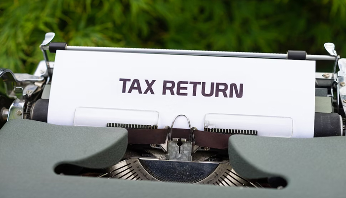 This image portrays a Tax Return written by a typewriter.— Unsplash