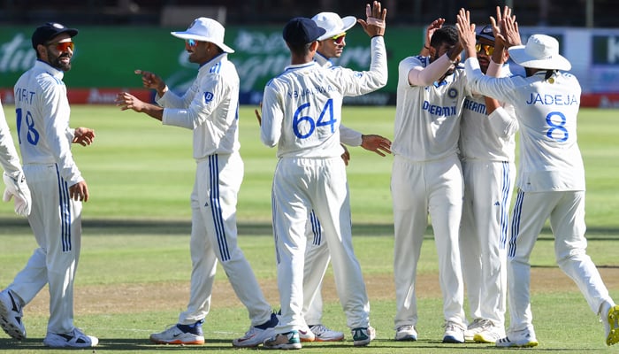 Indias Jasprit Bumrah (3rd R) celebrates with teammates after the dismissal of South Africas Tristan Stubbs (unseen) during the first day of the second cricket Test match between South Africa and India at Newlands stadium in Cape Town on January 3, 2024. — AFP